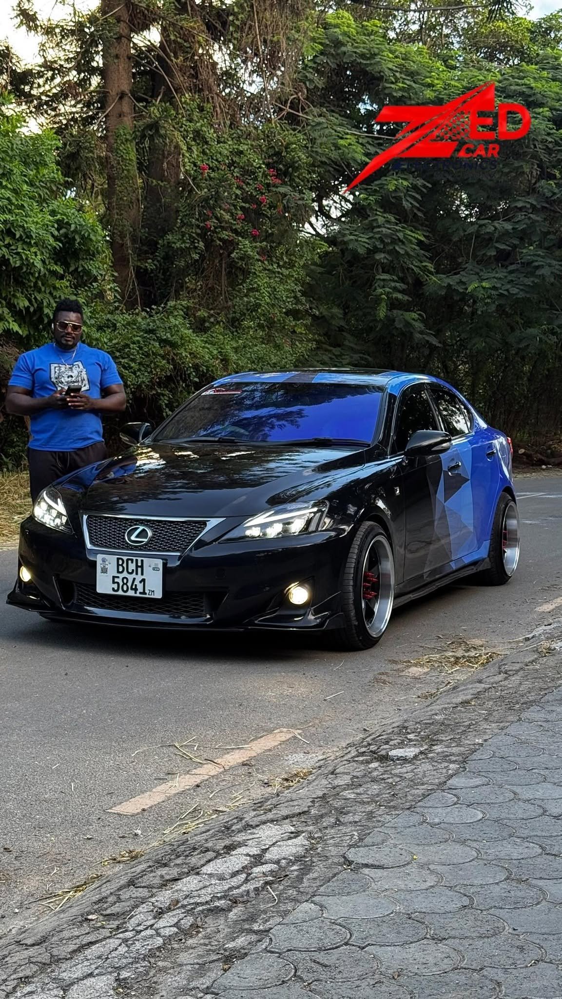 Lexus IS wrapped in blue camouflage vinyl